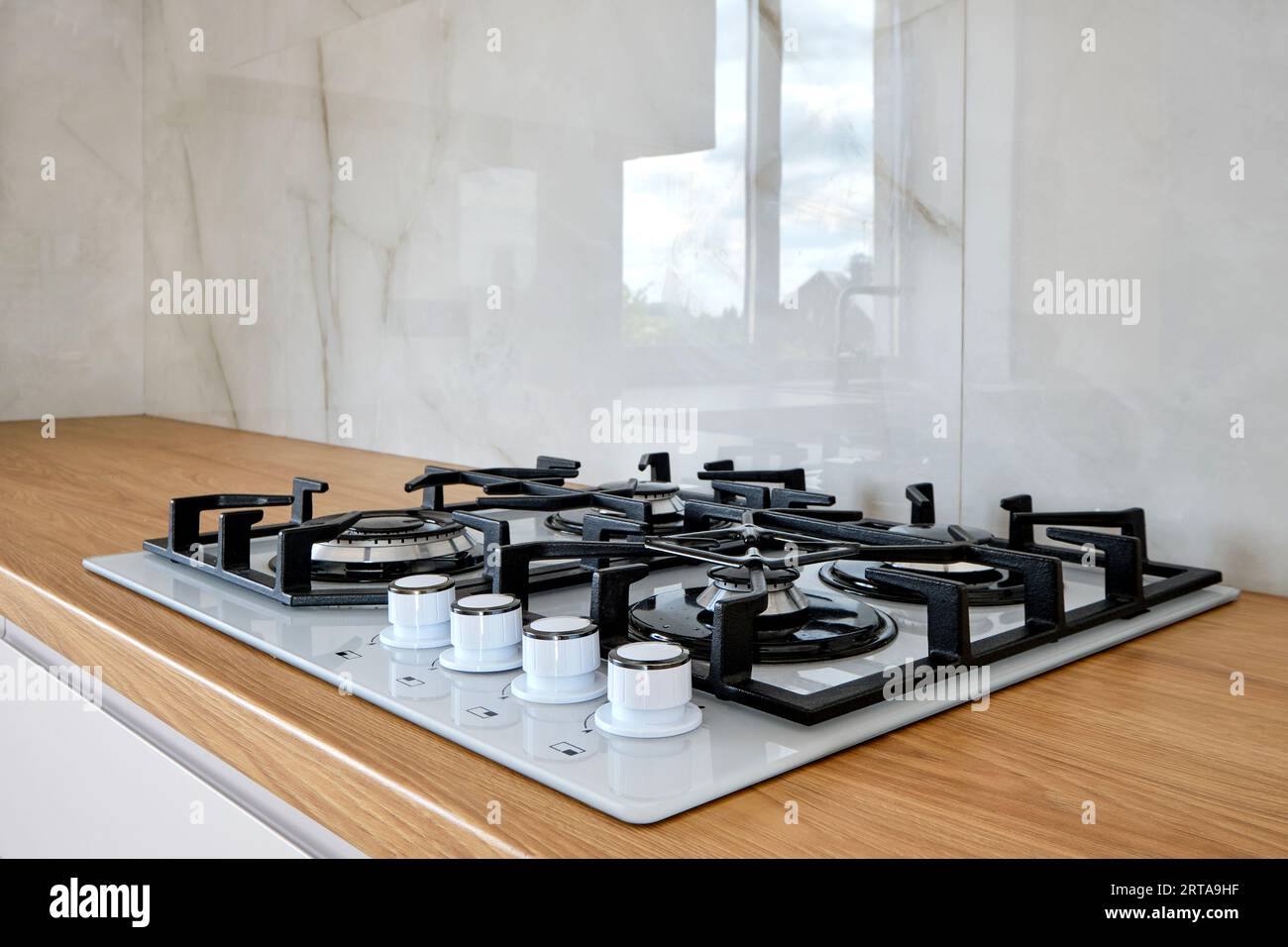 modern-built-in-gass-stove-on-wooden-countertop-2RTA9HF